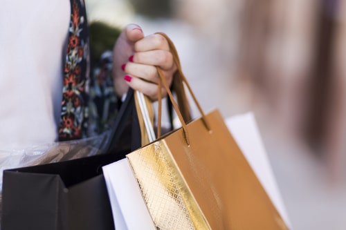 hand-carrying-paper-bags
